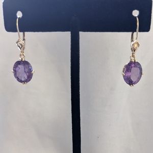 14 K gold earrings with purple stones